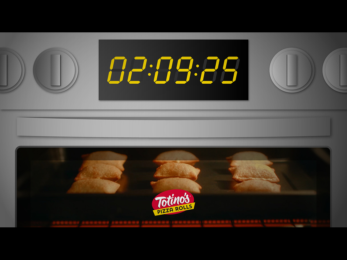 Oven filled with Totino's Pizza Rolls with a timer set to 02:09:25